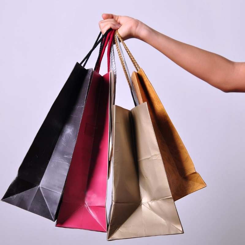 shopping bags containing inexpensive wedding gifts