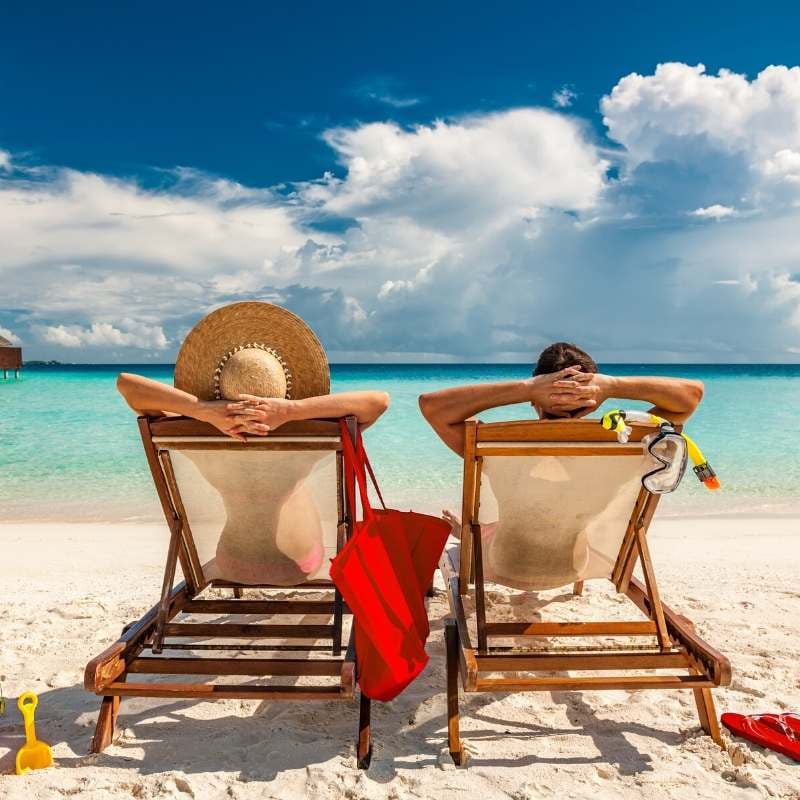 married couple on beach enjoying inexpensive wedding gifts