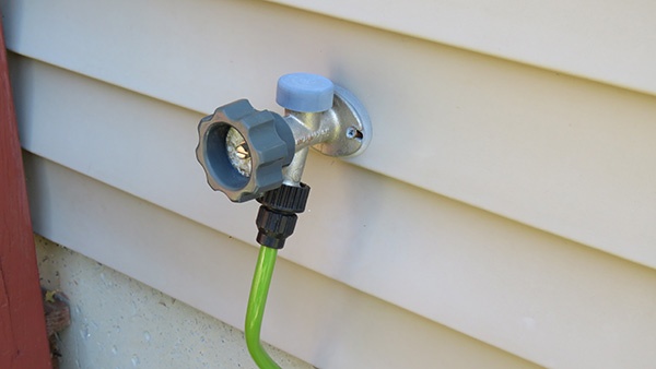 Garden hoses attached to home