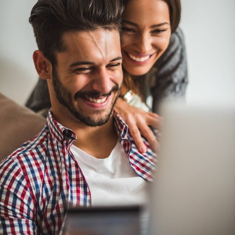couple at computer getting a credit line increase