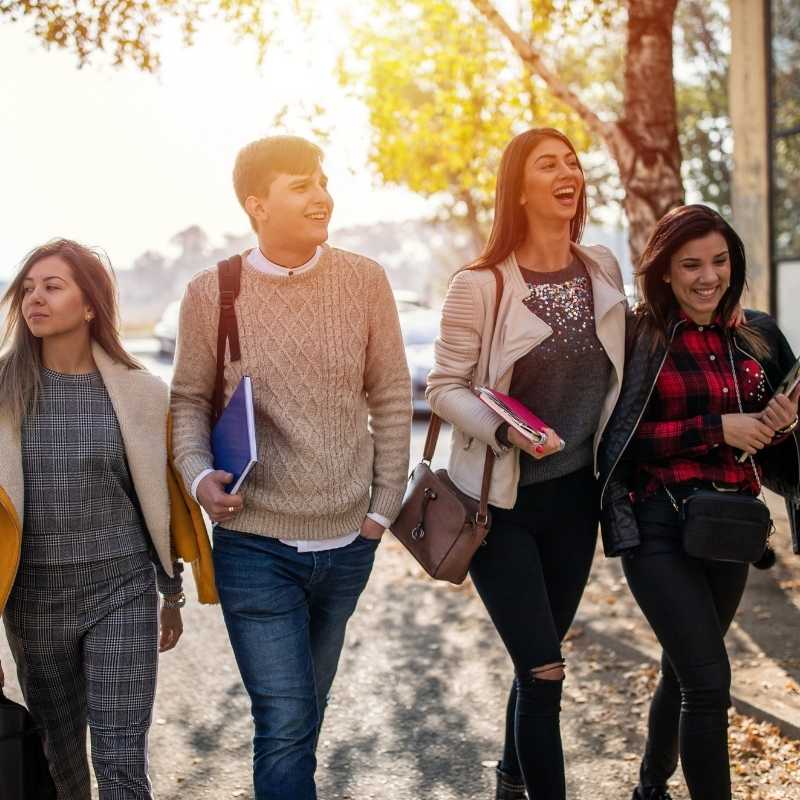 4 college students walking outside