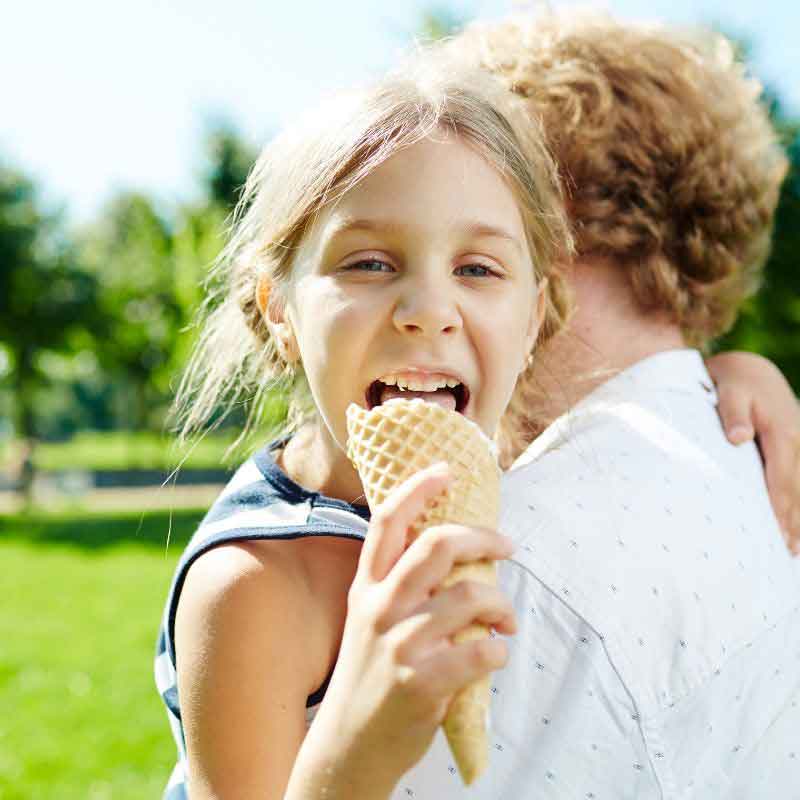 little girl eating ice cream cone
