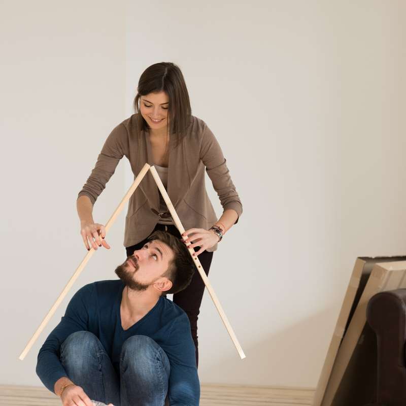 young couple settling into new condo