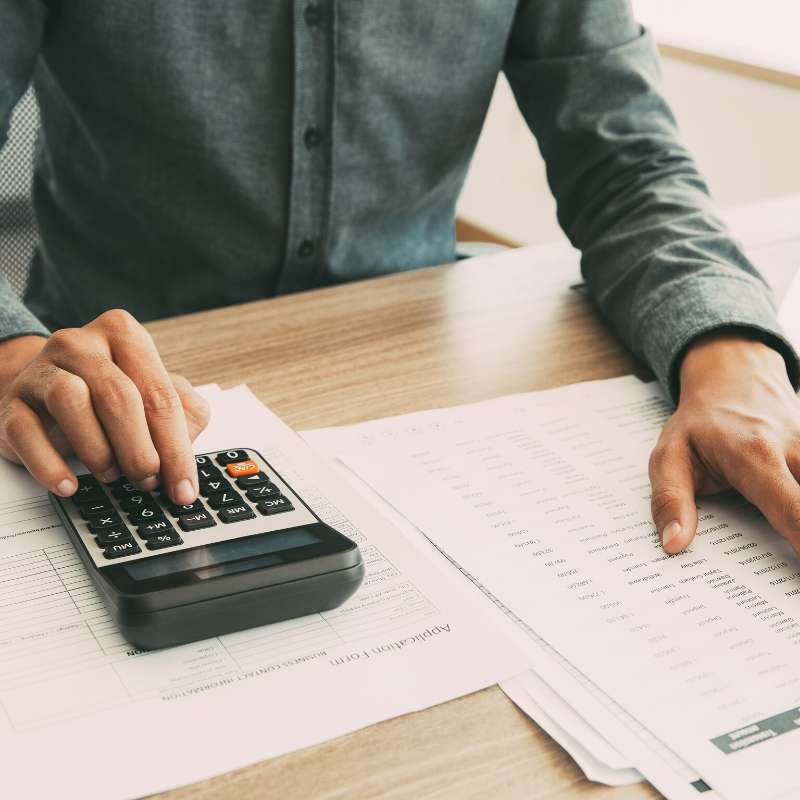 man calculating reduced income