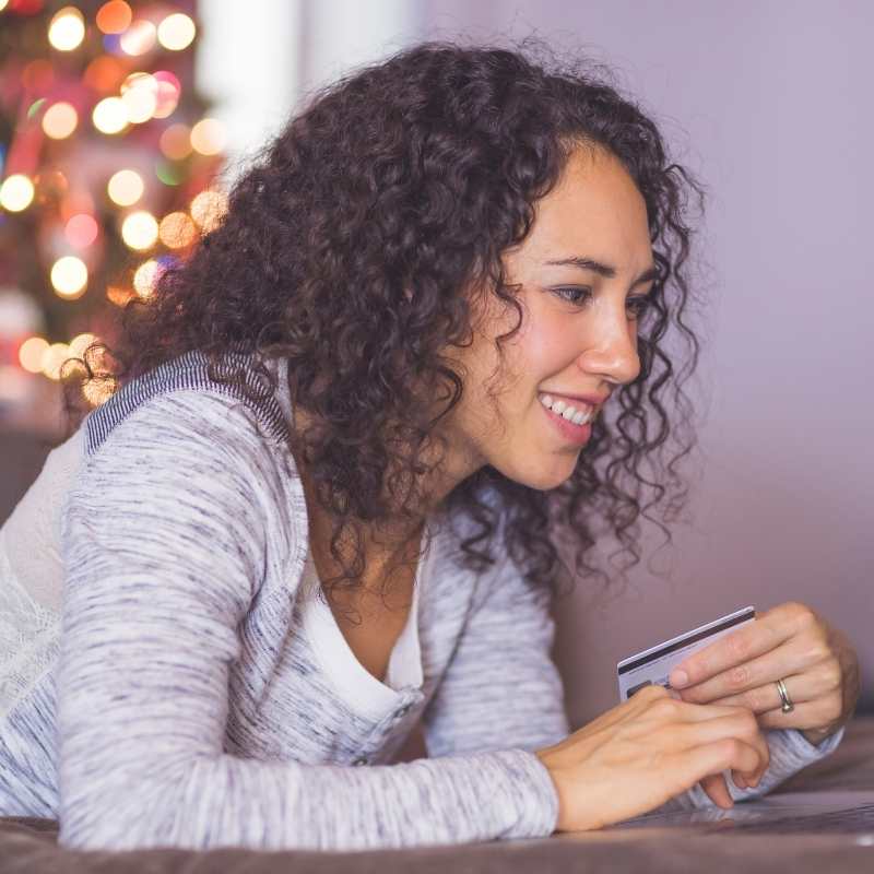 young woman online shopping at computer