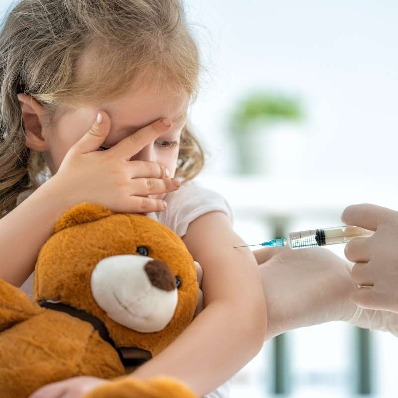 little girl getting COVID vaccine