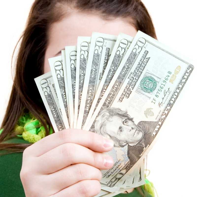 woman holding unclaimed money
