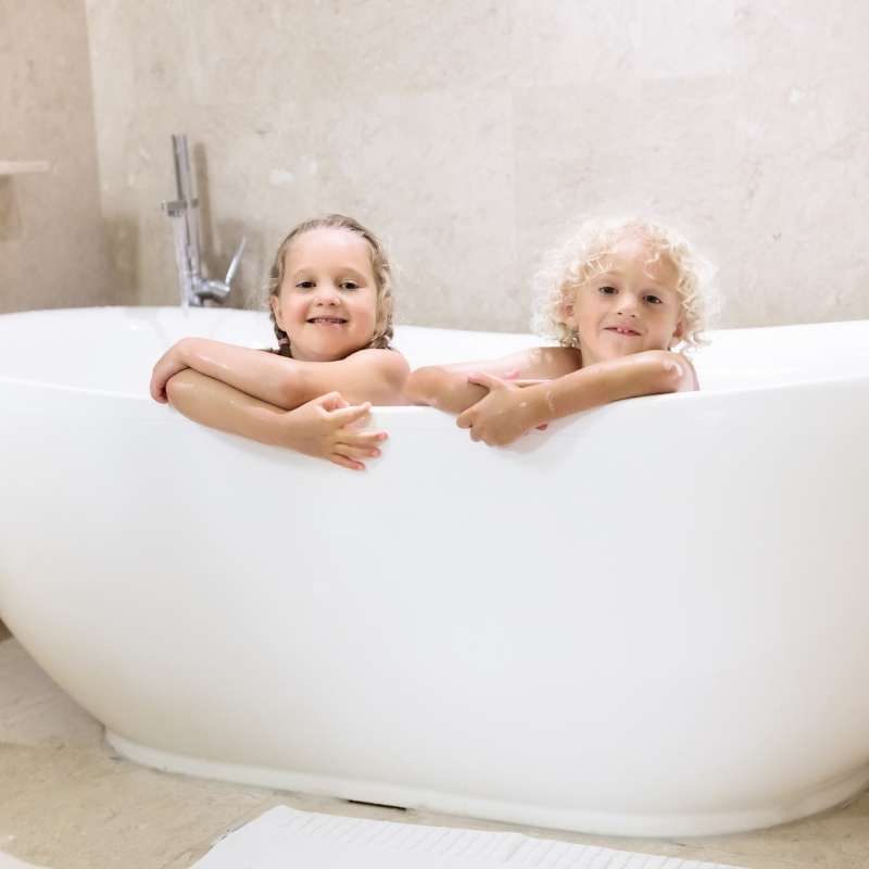 two young children in a designer bathtub